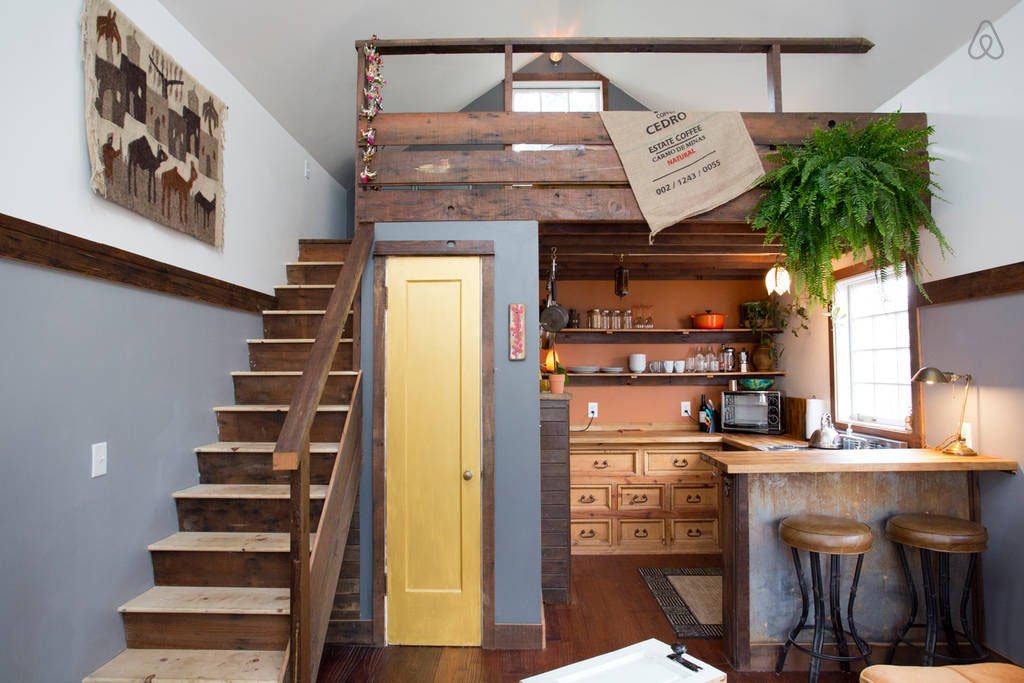 A cozy rustic tiny house interior with vintage decor elements.