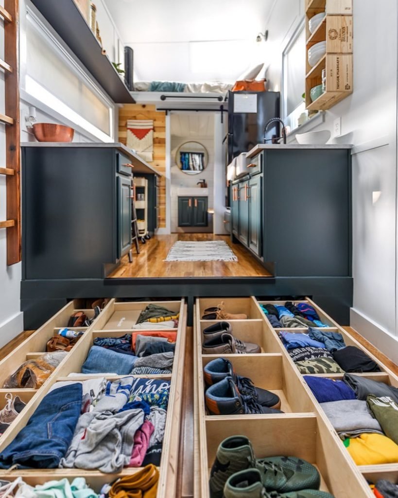 A tiny house interior with built-in storage solutions for a family.
